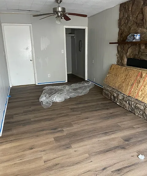 2 living areas. New flooring and fresh paint, this is the front den.