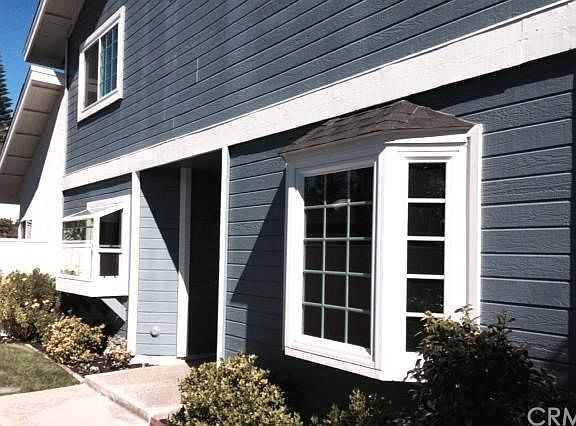Front entrance to house, bay window in Den