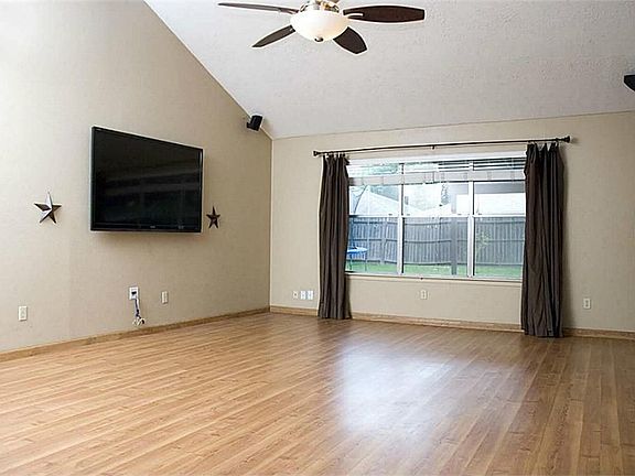 The family room has attractive laminate wood flooring and surround sound.