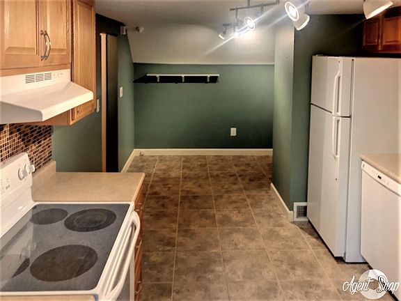 Kitchen with dining area at the other end.