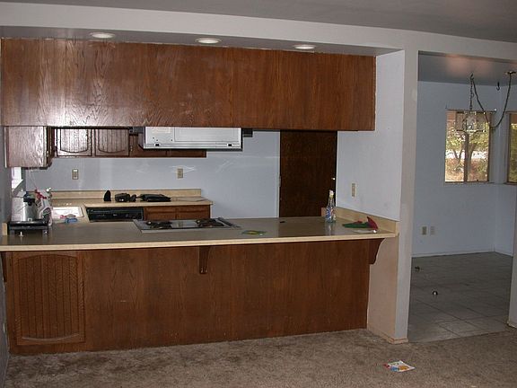 Kitchen area looks into the living room and family room.