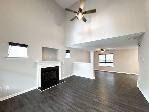 Living room with dining room in view.