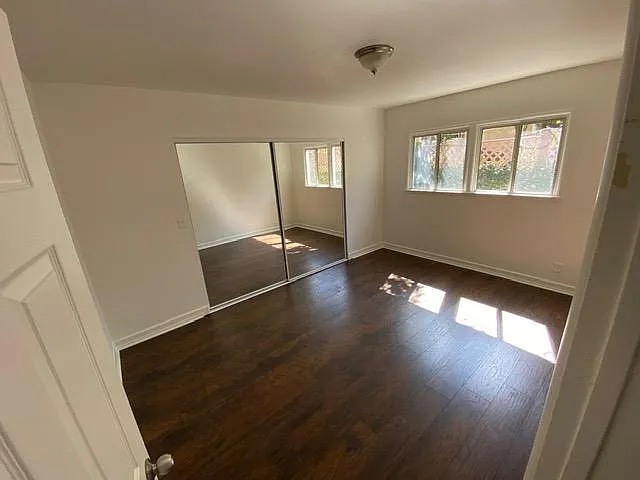 bedroom one. Brand new hardwood floor with large closet.