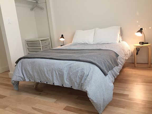 Bedroom is spacious and has a full wall of closets