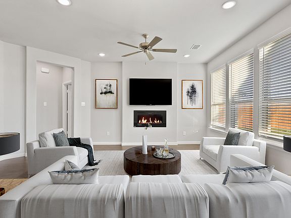 Living room in the Nobel home plan by Trophy Signature Homes - REPRESENTATIVE PHOTO