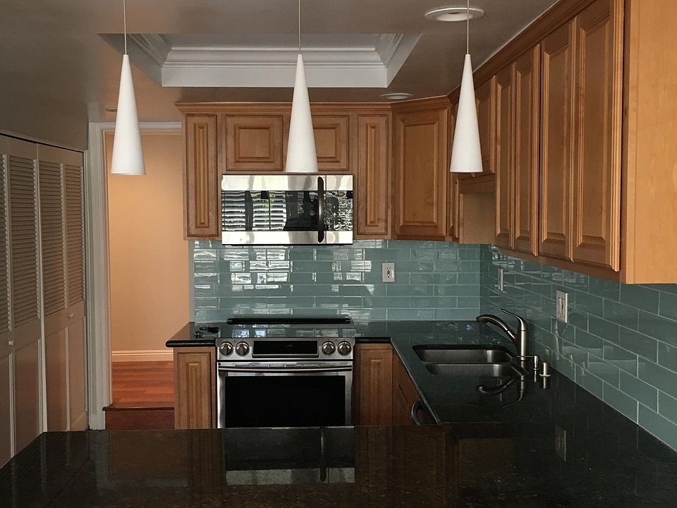 Kitchen has large counter for barstools