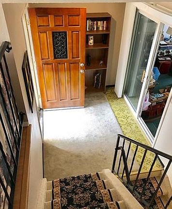 Foyer is main level- sliding glass door takes you to the enclosed patio currently used as an office.