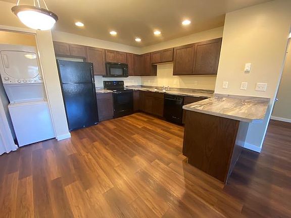 Kitchen with breakfast bar and laundry