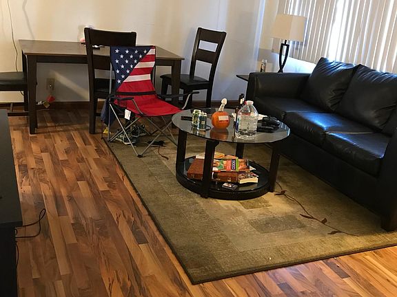 Living room with wood flooring.
