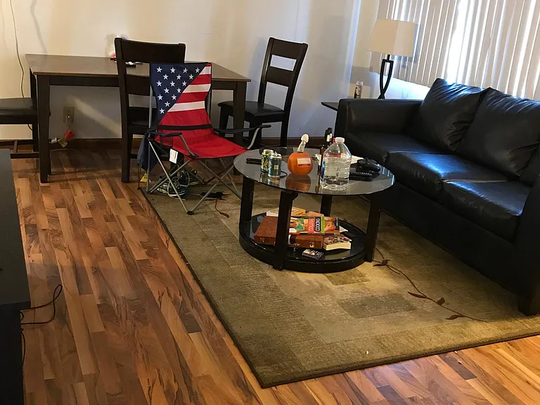 Living room with wood flooring.
