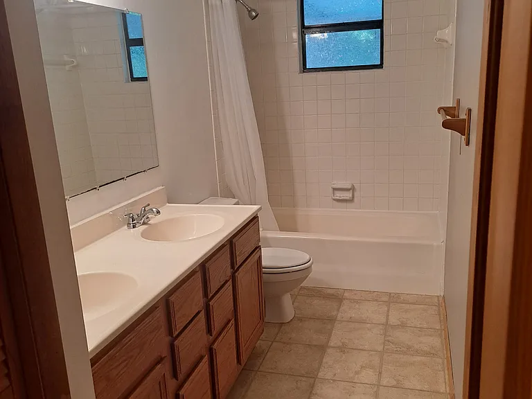 Double sink and shower with tub.