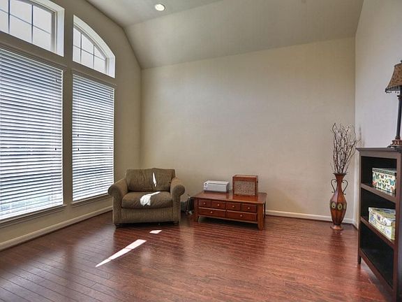 Study with lovely wood floors and French doors for privacy.
