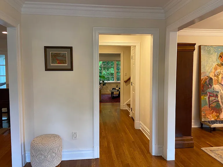 Foyer - LR to your left on entry and DR to right. Family room straight ahead. Coat closet and powder room off hallway to left; door on right for stairway to garage.