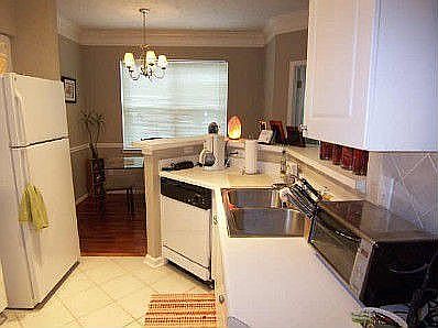 Kitchen opens to dining area