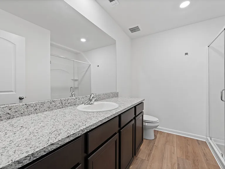 Large granite vanity in the master bedroom.