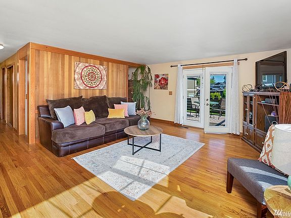 Living Room with hardwood floors, French doors to the deck.