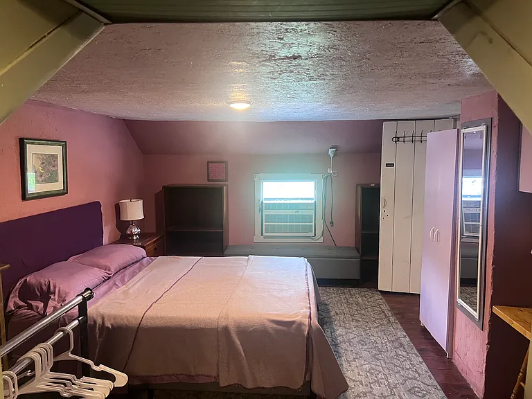 2nd floor bedroom #2. Queen bed with dressers and work area