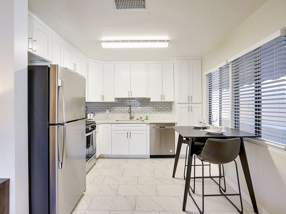 Kitchen View with stainless steel appliances and dining area