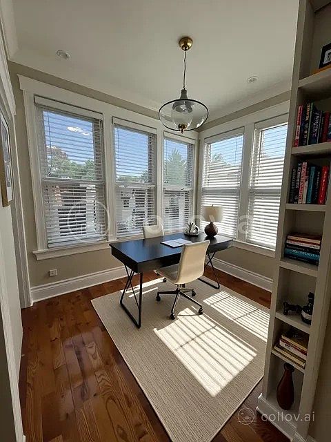 Sunroom makes for perfect home office or study space (virtual staged)