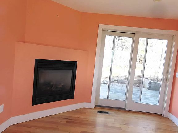 Kitchen eating area with gas fireplace & 2nd deck