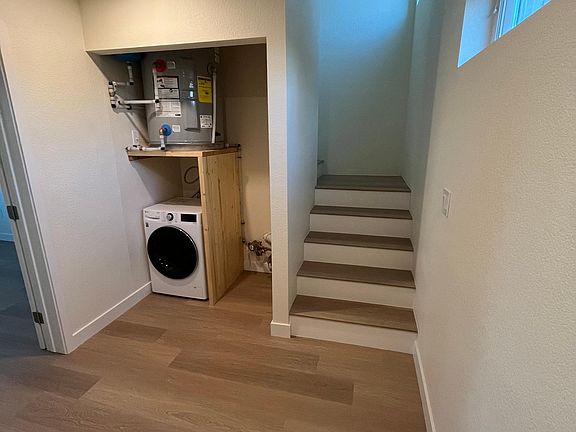 Entrance with integrated washer/dryer closet.