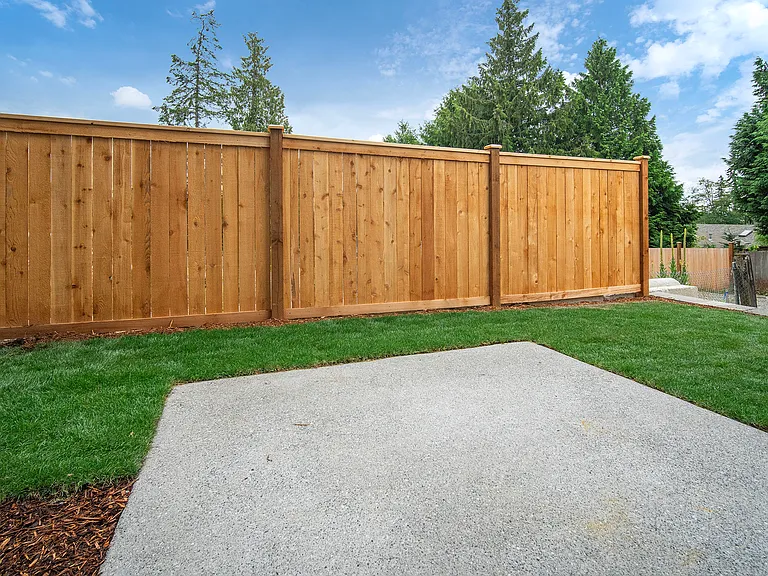 Fully fenced patio on lower level.