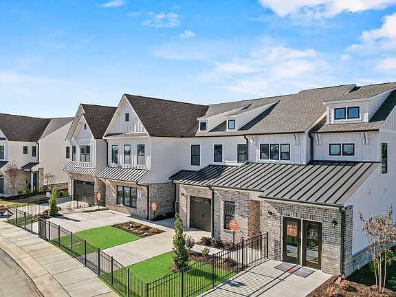 An aerial view of a row of houses in a residential area.