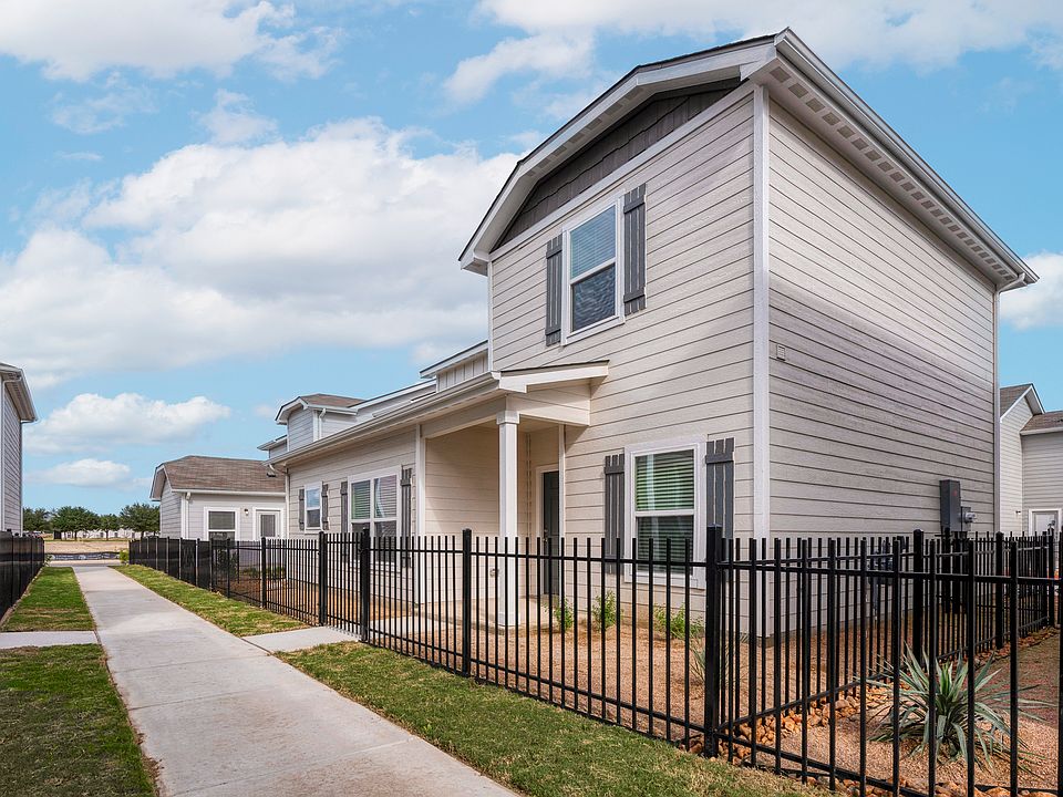 Exterior of the Brantley, showcases the wrap-around fence and professional landscaping.