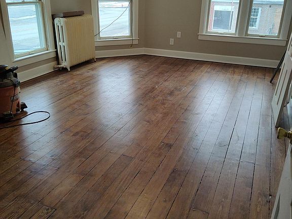 Main living space, refinished original pine floors.