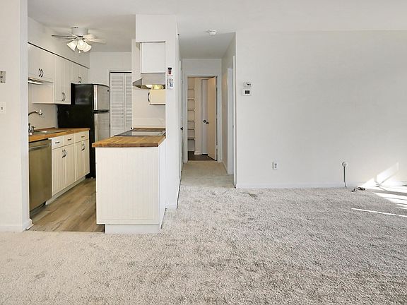 Real butcher block countertops in a updated IKEA kitchen.