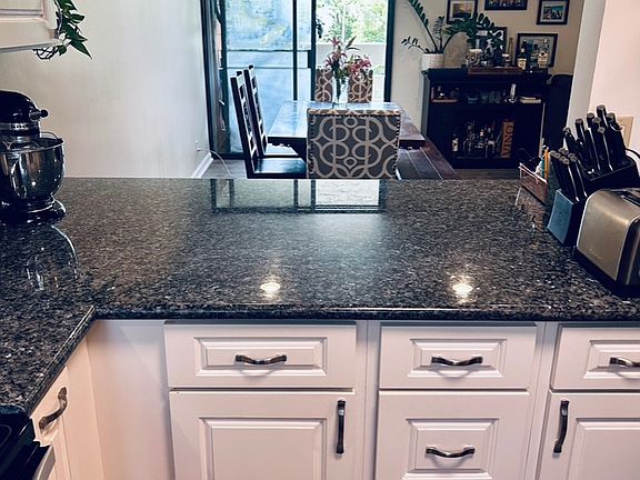 Kitchen to kitchen table to lanai (left side).