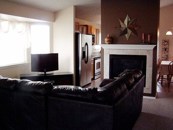 Open living room with fireplace.