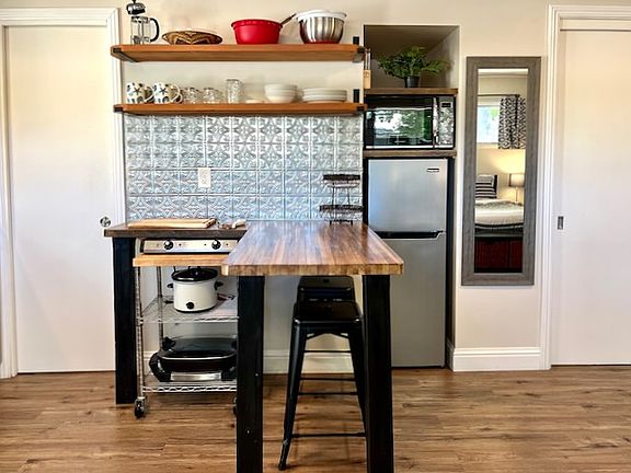 Kitchenette with refrigerator freezer and microwave