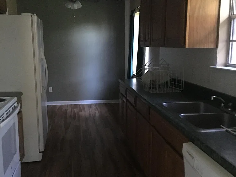 Kitchen, furnished electric stove, dishwasher and fridge. ki