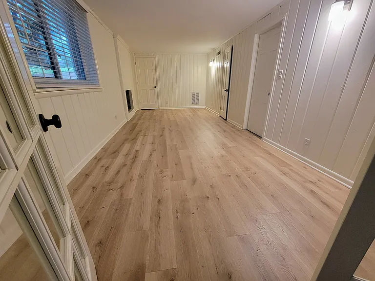 Basement bedroom featuring bathroom
