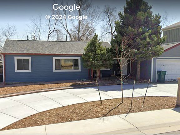 Google Maps view showing large circular concrete driveway with ample off street parking