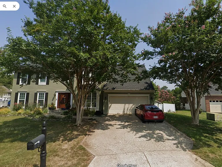 Mid Summer View of the front yard, with Crepe Myrtles on both sides of driveway giving shade and little library to the right.