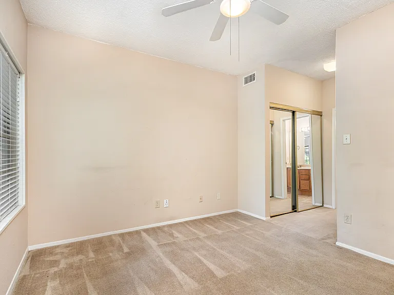Secondary bedroom with two closets.