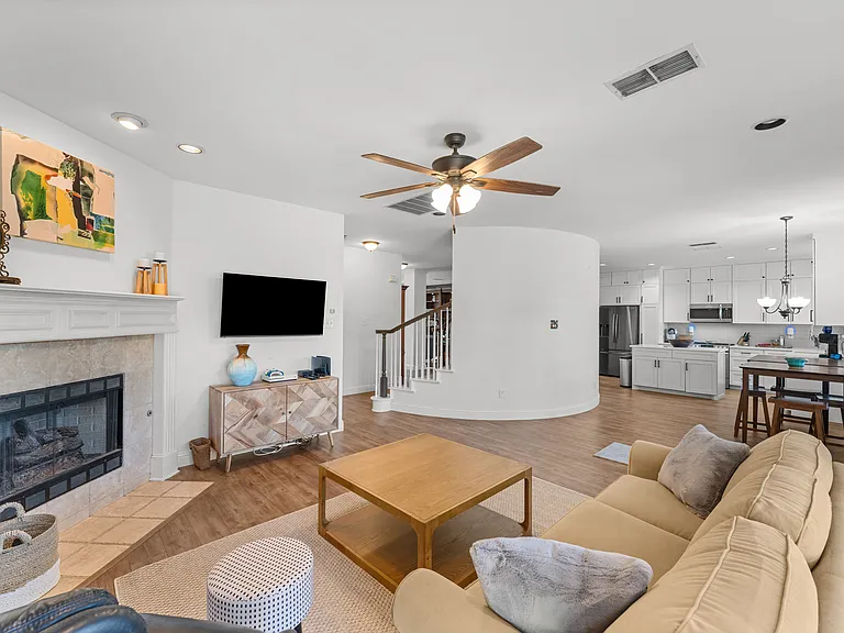 Warm, inviting room with soft seating and a wood-burning fireplace_perfect for unwinding.