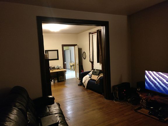 View from bedroom, through living room and into kitchen.