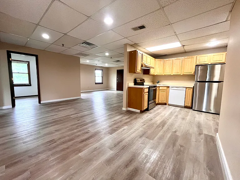 Dining/kitchen area looking at living room and office/den