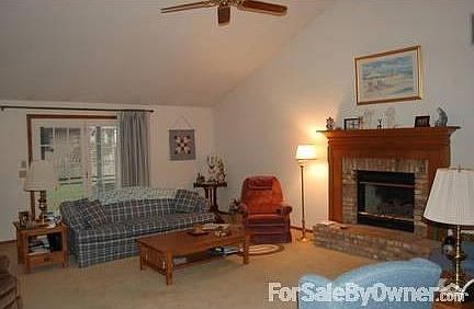 Great Room Fireplace and Patio Doors : Cathedral Ceilings-gas fireplace with raised hearth