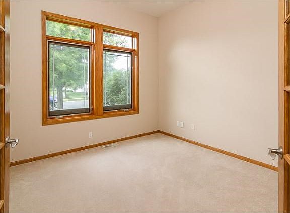 Just off the front entryway, through the glass French doors, is the home office. It could also serve as a toy room, or add curtains to the doors for an additional bedroom!