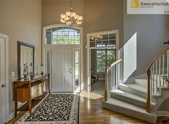 Soaring Ceilings & Gorgeous Curved Staircase Will "Wow" You the Minute you Walk in the Door!