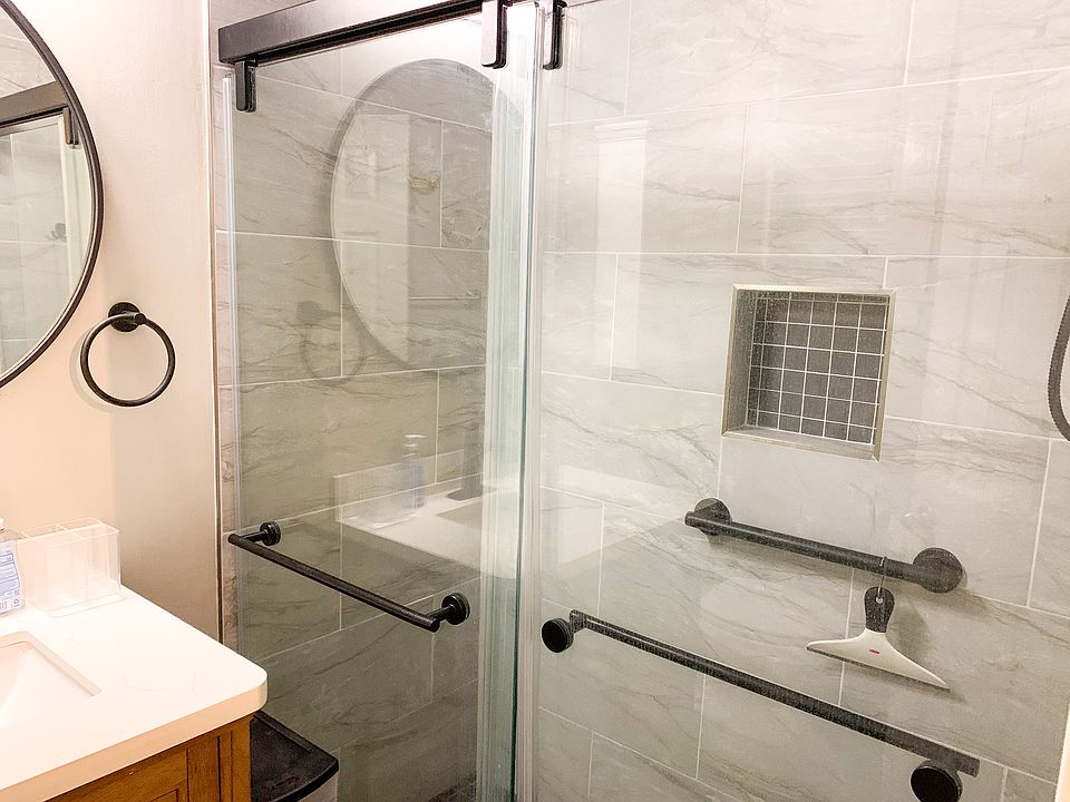 Renovated bathroom with a walk-in shower.