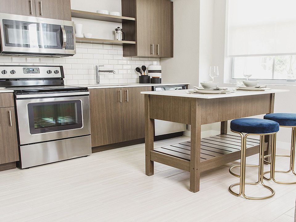 Kitchens with open display shelving and movable islands