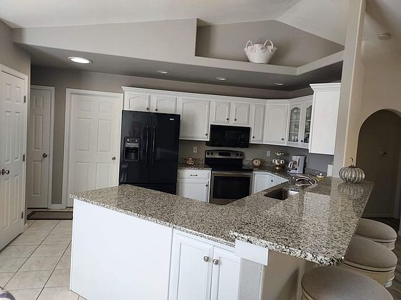 Kitchen with fresh paint, newer granite, nice pantry, laundry room off the backside and entry to garage