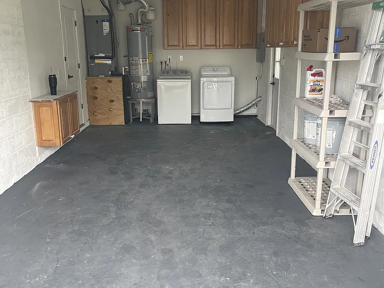 Large single car garage with washer, dryer and lots of storage.