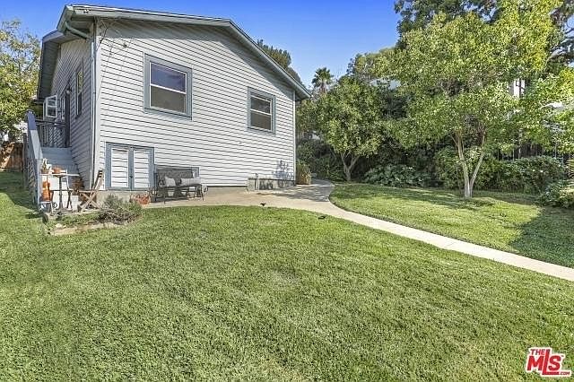 Apt for rent is left half of this duplex building.