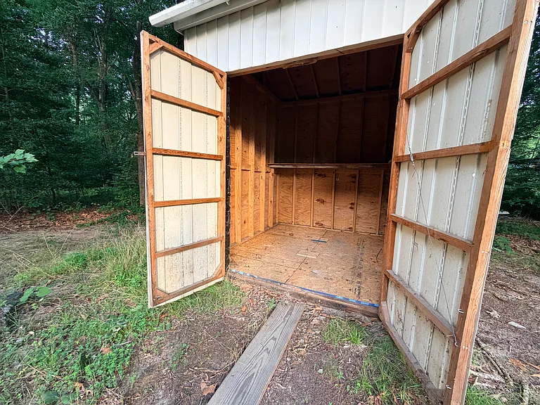 Additional storage available in shed in back of property. Perfect for lawn tools, bikes, storing sports equipment, or additional items requiring a little more space.